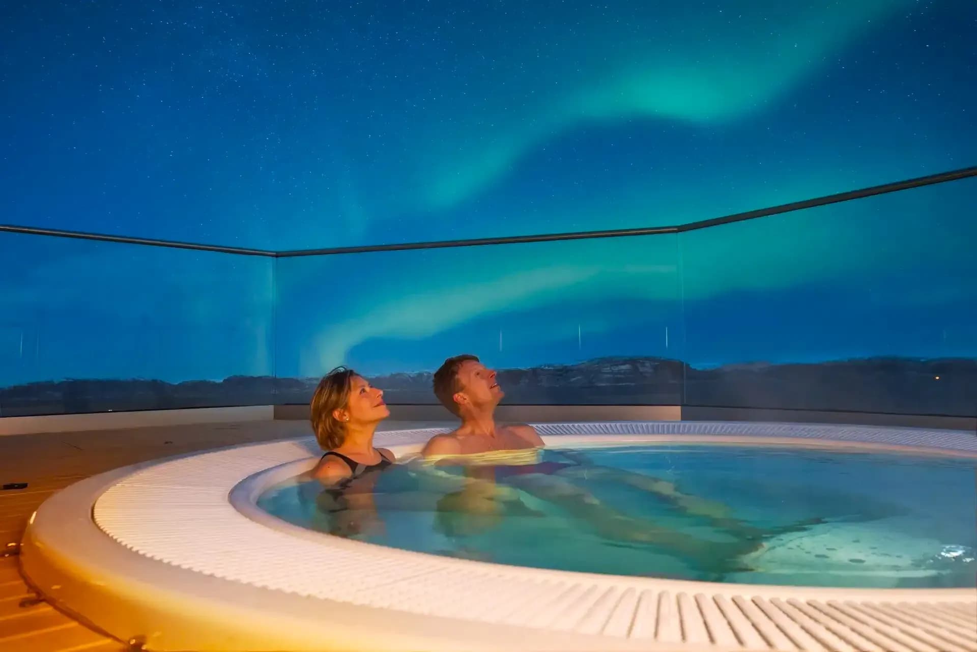 Viewing Northern lights on a hot tub on Hurtigruten cruise